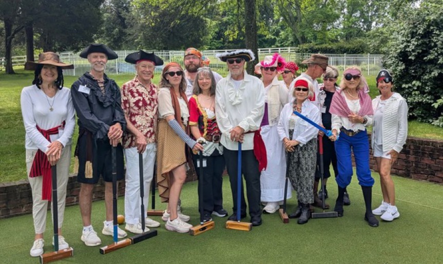 Croquet players in pirate costumes